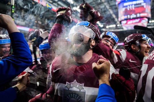 Kaspars Daugavins of Latvia celebrates with team mates