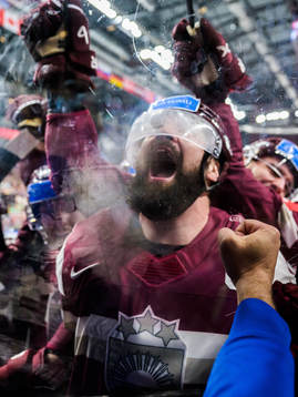 Kaspars Daugavins of Latvia celebrates with team mates