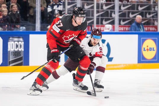 Tyler Myers of Canada and Renars Krastenbergs of Latvia