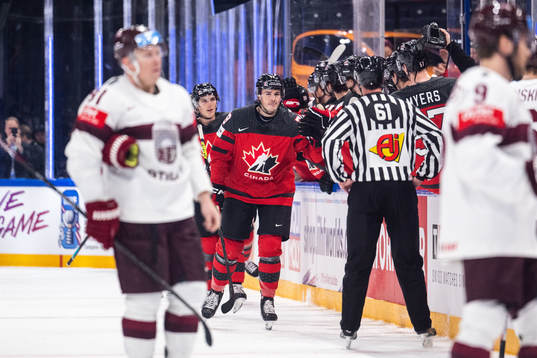 Samuel Blais of Canada celebrates with team mates