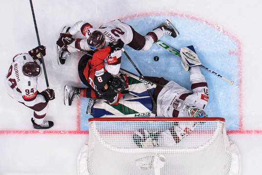 Cody Glass of Canada challenges Kristians Rubins, Karlis