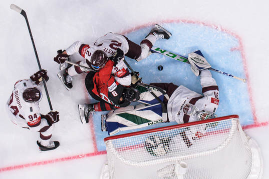 Cody Glass of Canada challenges Kristians Rubins, Karlis