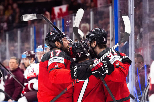 Justin Barron, Milan Lucic, Brad Hunt and Adam Fantilli of