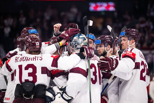 Goaltender Arturs Silovs of Latvia with team mates