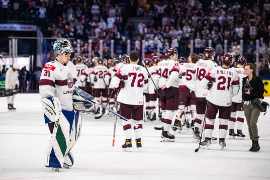 Goaltender Arturs Silovsof Latvia looks dejected