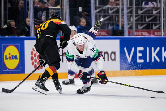 Wojciech Stachowiak of Germany tackles Dylan Samberg of USA