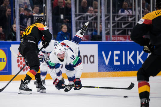 Wojciech Stachowiak of Germany tackles Dylan Samberg of USA