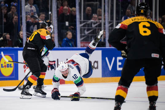 Wojciech Stachowiak of Germany tackles Dylan Samberg of USA