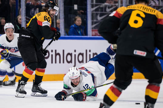 Wojciech Stachowiak of Germany tackles Dylan Samberg of USA
