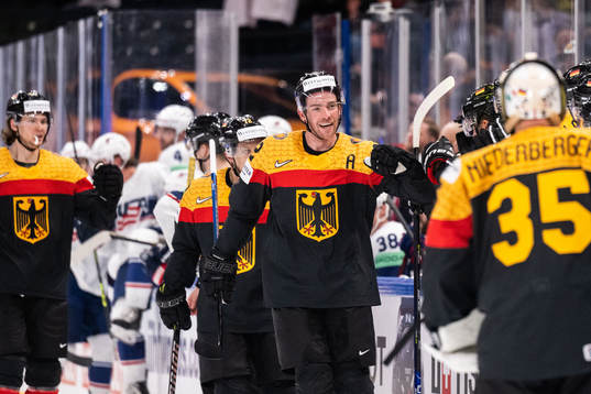 Marcel Noebels of Germany celebrates with team mates