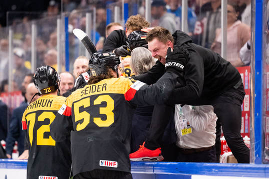 Dominik Kahun and Moritz Seider of Germany celebrate with