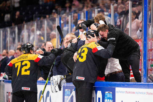 Dominik Kahun and Moritz Seider of Germany celebrate with