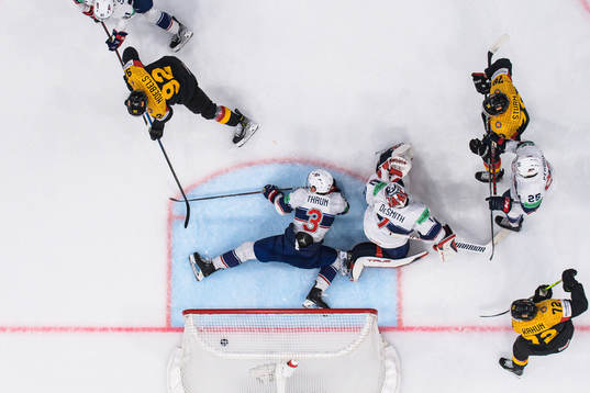 Marcel Noebels of Germany scores 3-3 behind Henry Thrun and