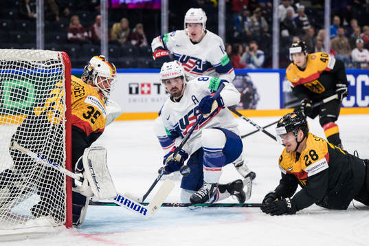 Goaltender Mathias Niederberger and Samuel Soramies of