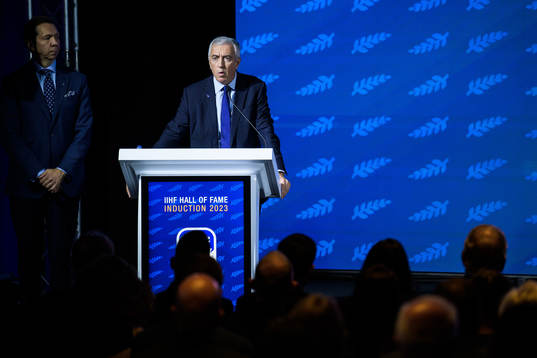 Luc Tardif, president of the IIHF, holding a speech