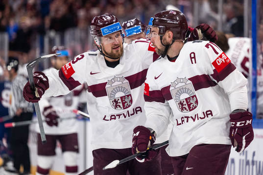 Rihards Bukarts and Roberts Bukarts of Latvia celebrate