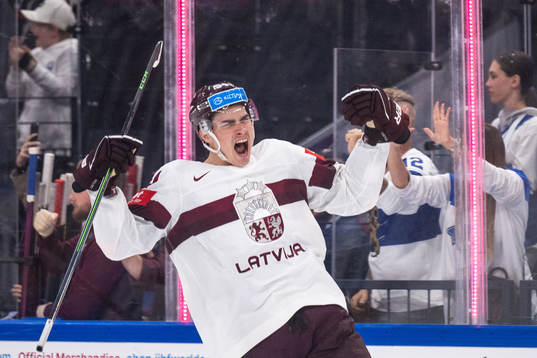 Kristians Rubins of Latvia celebrates scoring 3-3