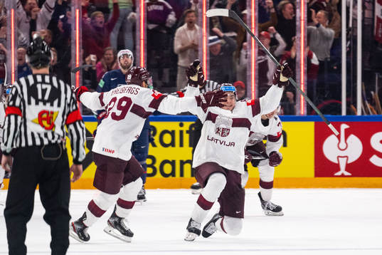 Kristians Rubins of Latvia celebrates scoring 3-3