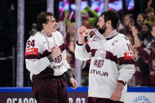 Kristians Rubins and Kaspars Daugavins of Latvia celebrate