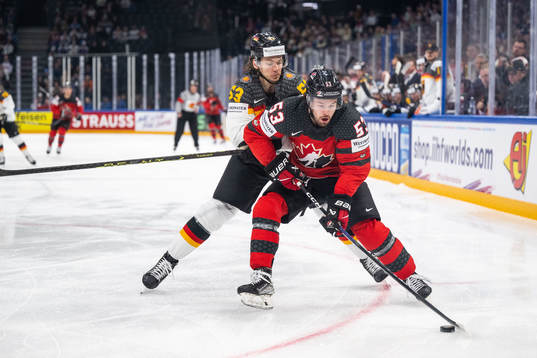 Moritz Seider of Germany and Michael Carcone of Canada