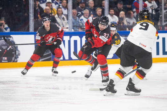 Jack Quinn and Scott Laughton of Canada and Fabio Wagner