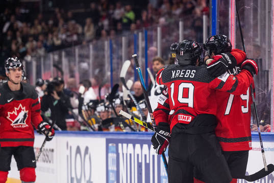 Peyton Krebs and Samuel Blais of Canada celebrate scoring