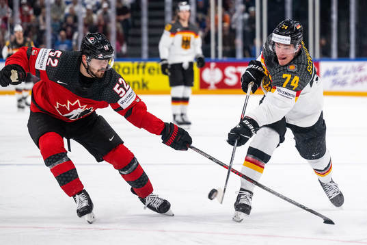 MacKenzie Weegar of Canada and Justin Schutz of Germany