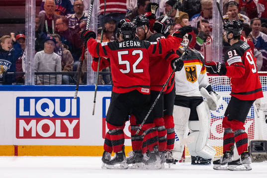 MacKenzie Weegar, Lawson Crouse and Adam Fantilli of Canada
