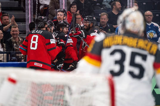 Samuel Blais of Canada celebrates with teammates