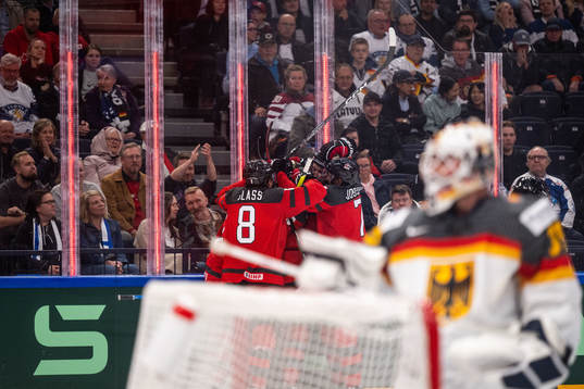 Samuel Blais of Canada celebrates with teammates