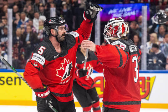 Jacob Middleton and goaltender Samuel Montembeault of