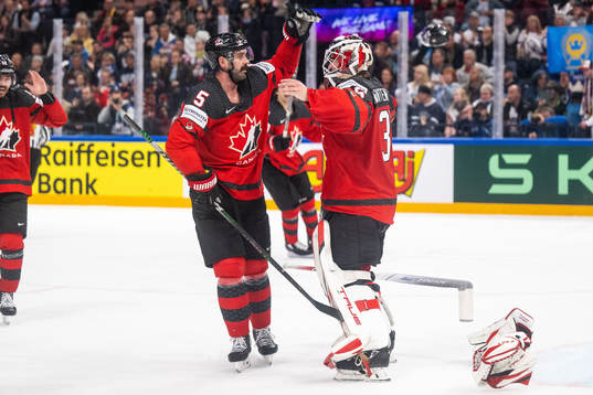 Jacob Middleton and goaltender Samuel Montembeault of