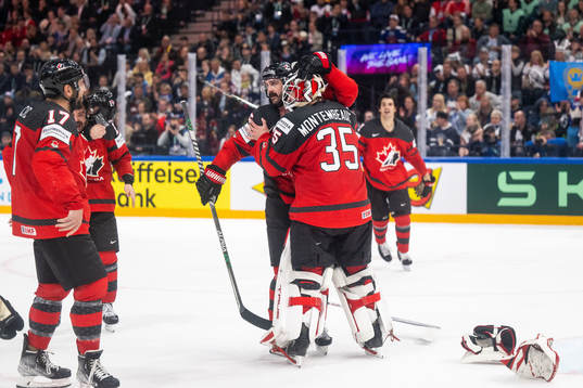 Jacob Middleton and goaltender Samuel Montembeault of