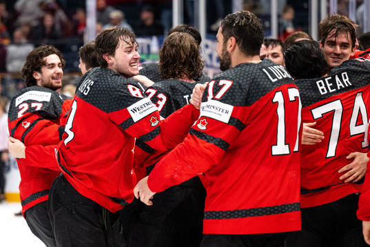 Cody Glass and Milan Lucic of Canada celebrate