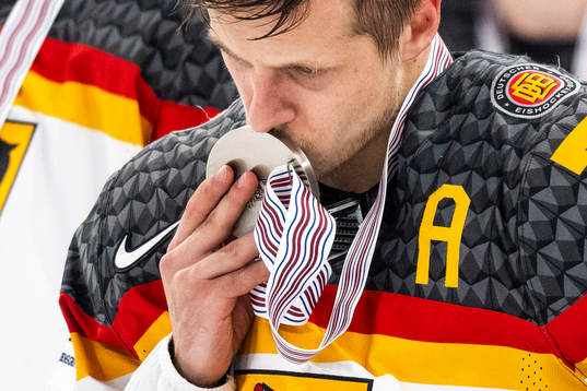 Dominik Kahun of Germany looks dejected and gives the