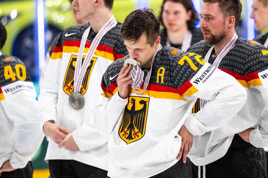 Dominik Kahun of Germany looks dejected and gives the