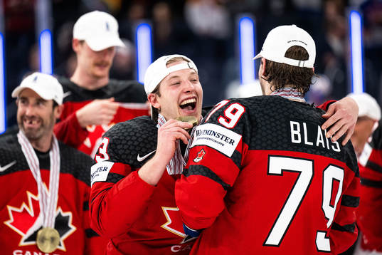 Jake Neighbours and Samuel Blais of Canada celebrate