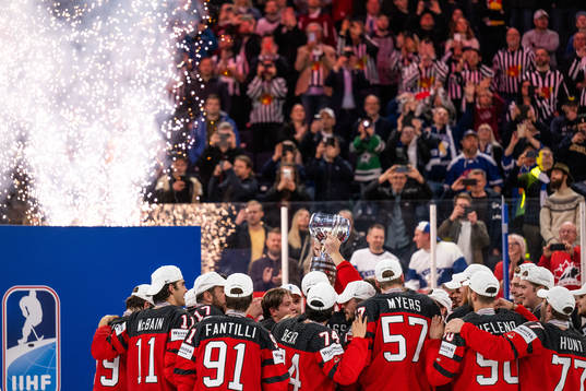 Players of Canada celebrate with the trophy