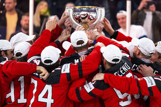 Players of Canada celebrate with the trophy