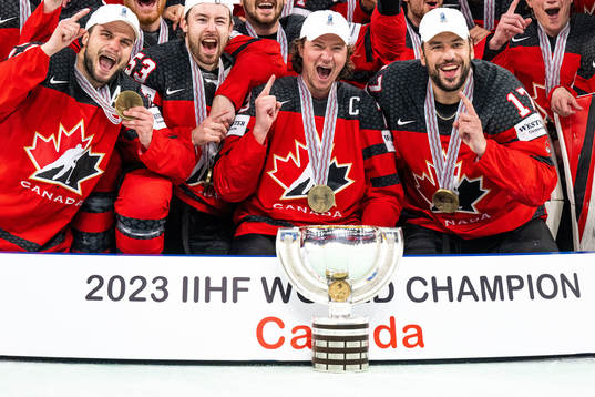 Players of Canada celebrate with the trophy
