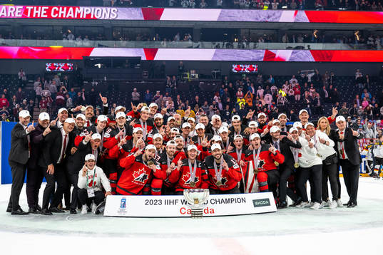 Players of Canada celebrate with the trophy