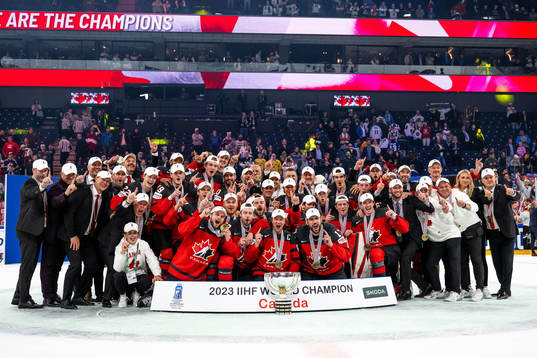 Players of Canada celebrate with the trophy