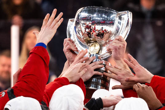 Players of Canada celebrate with the trophy