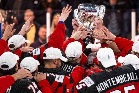 Players of Canada celebrate with the trophy