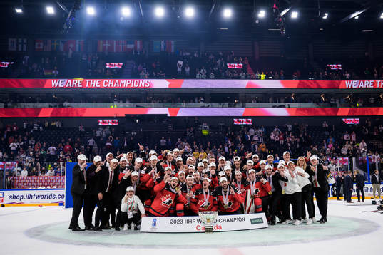 Players of Canada celebrate with the trophy