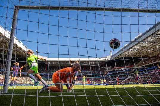 Alexandra Popp of Wolfsburg scores 0-2  behind goalkeeper