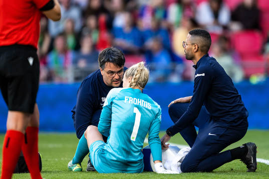Goalkeeper Merle Frohms of Wolfsburg in pain