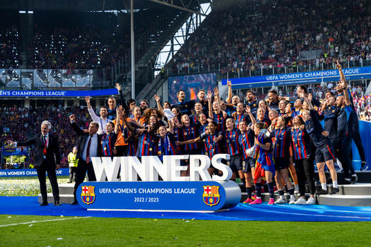 Players of Barcelona celebrate with the trophy