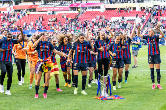 Playersof Barcelona celebrate with the trophy