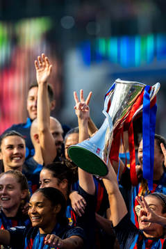 Player of Barcelona celebrates with the trophy